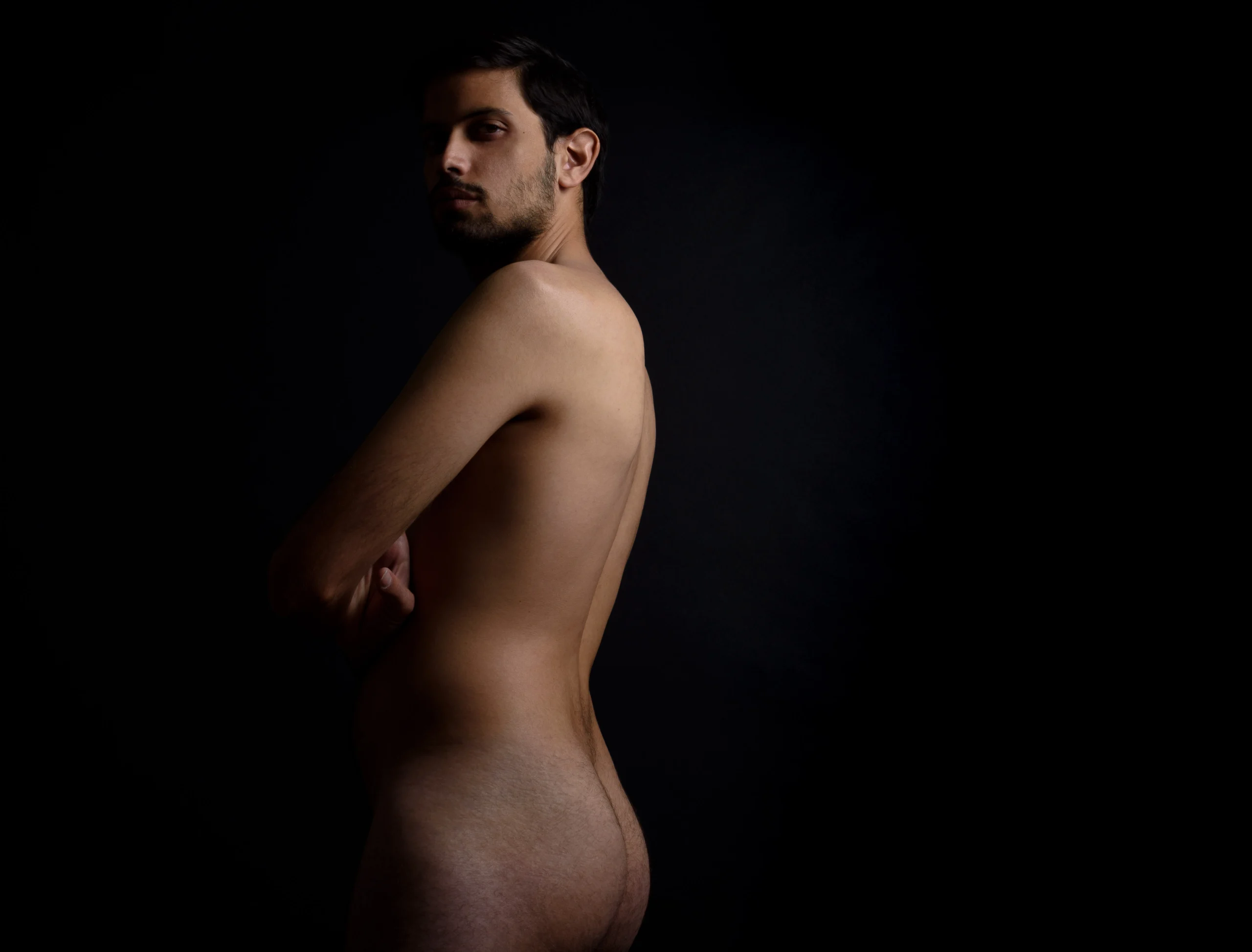 Male model naked in photo studio